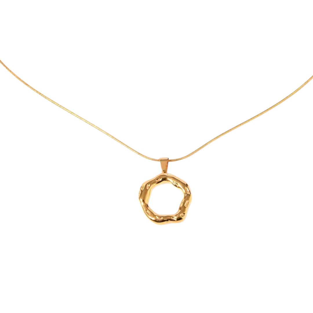 Gold necklace with a unique pendant on a white background